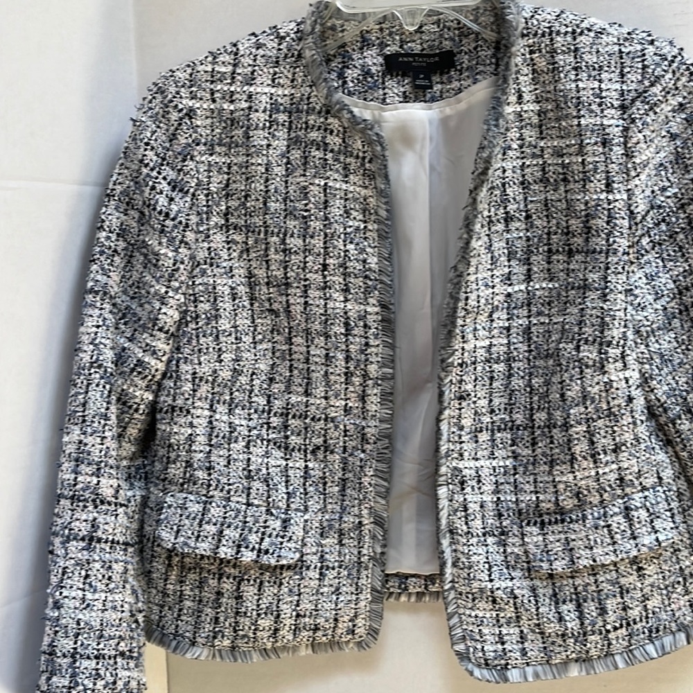 Gray, navy and white tweed jacket with fringe trim.